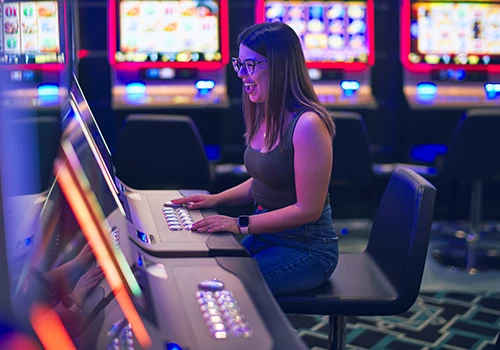 A woman playing a game in a casino